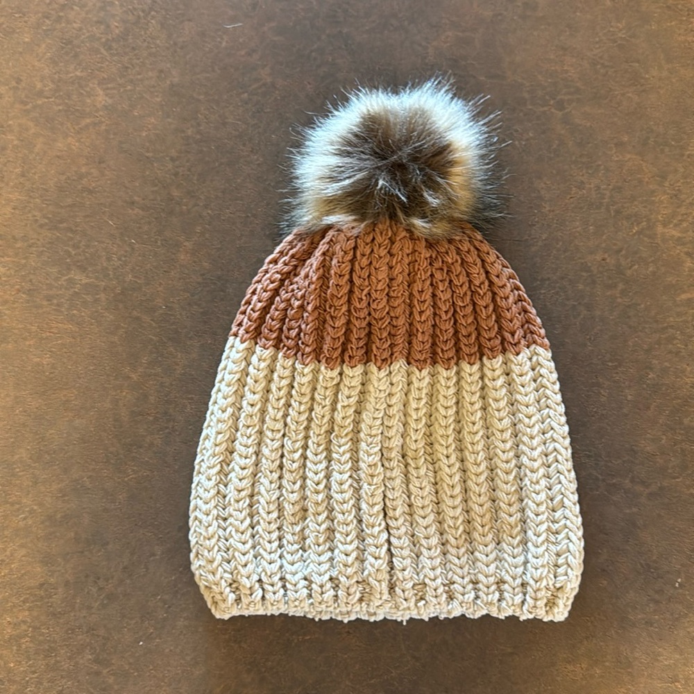 Aerie beanie. Tan and rust with a fluff.